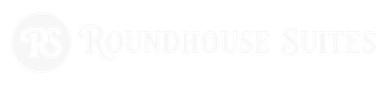 Beachside Hotel Roundhouse Suites logo with light gray circular emblem and text on white background