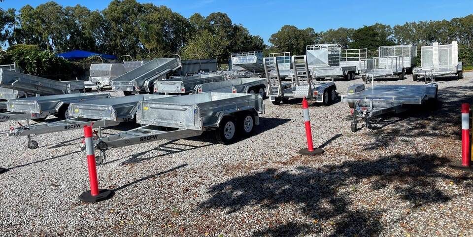 Trailer Yard with Stacked Metal Panels, Trailers — SSCFW Trailers In Mareeba, QLD