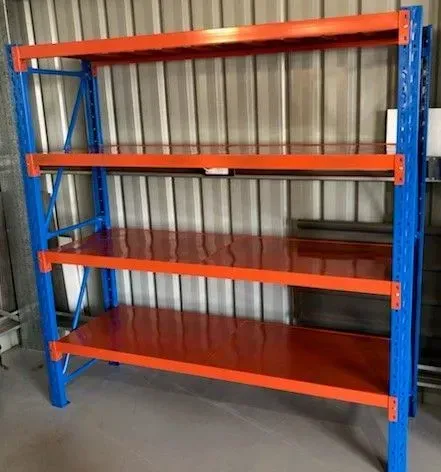 Blue and Orange Industrial Storage Rack with Four Shelves in A Warehouse — SSCFW Trailers In Mareeba, QLD