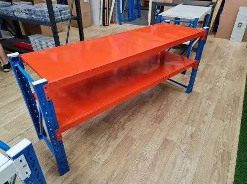 Red and Blue Metal Workbench with Shelves in A Workshop on A Wood Floor — SSCFW Trailers In Cairns, QLD