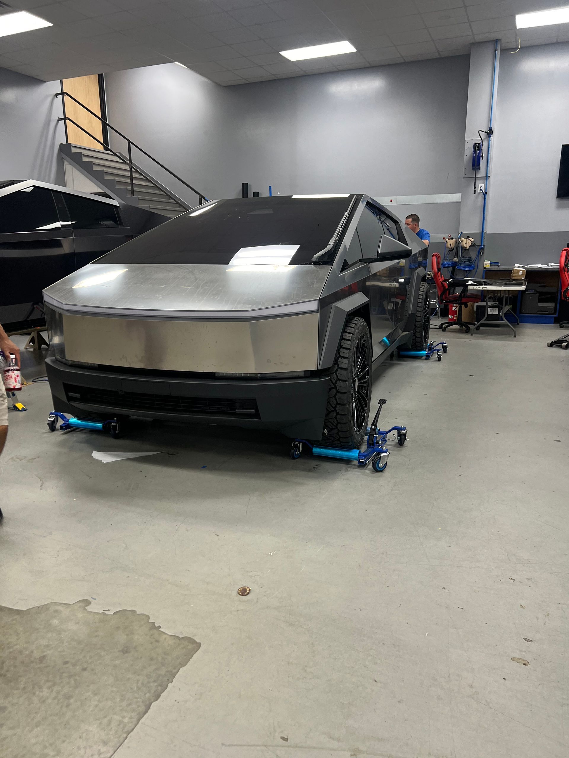 A tesla model s is parked in a garage.