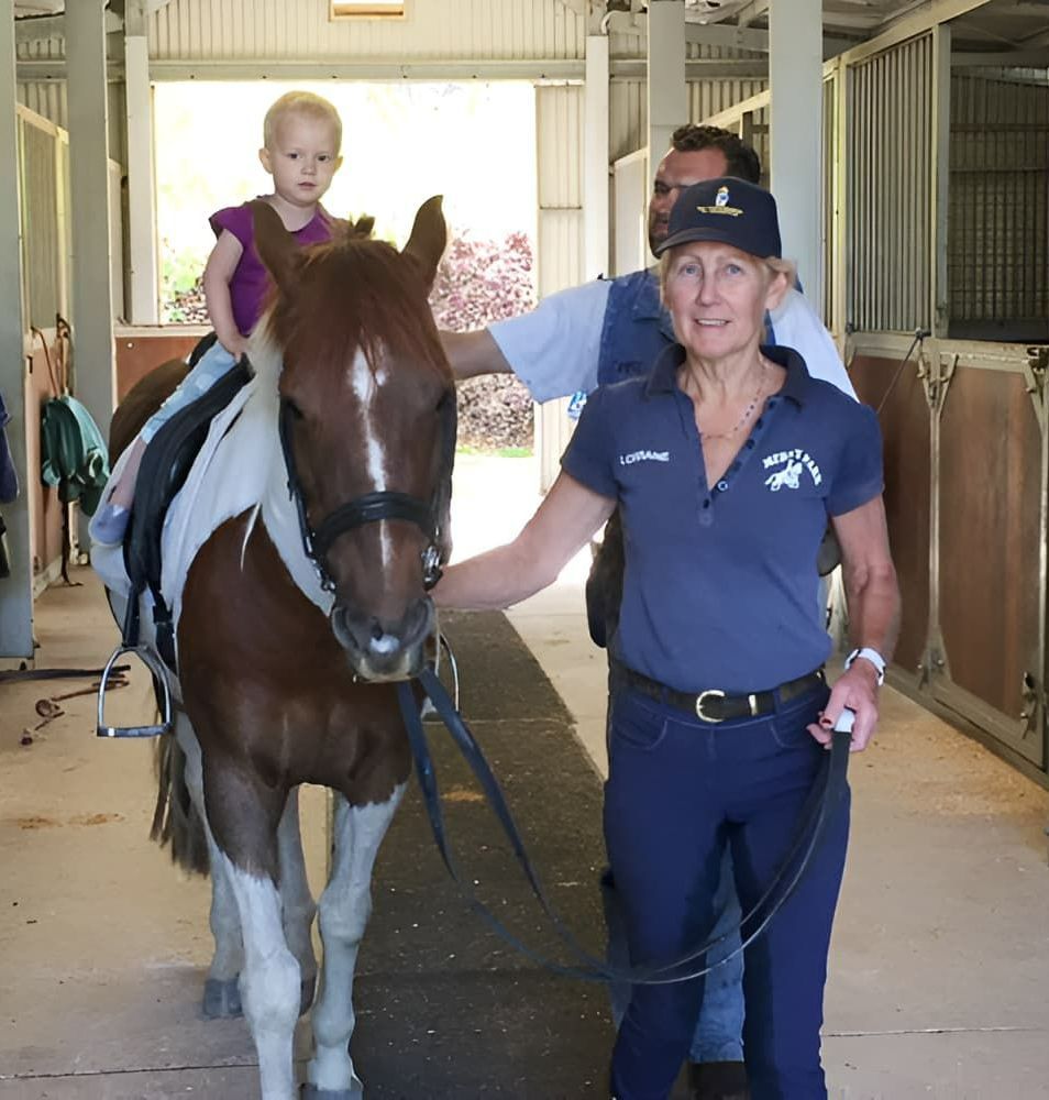A Little Girl Is Riding A Brown Horse In A Stable — Merrypark Equestrian Centre In Eumundi, QLD