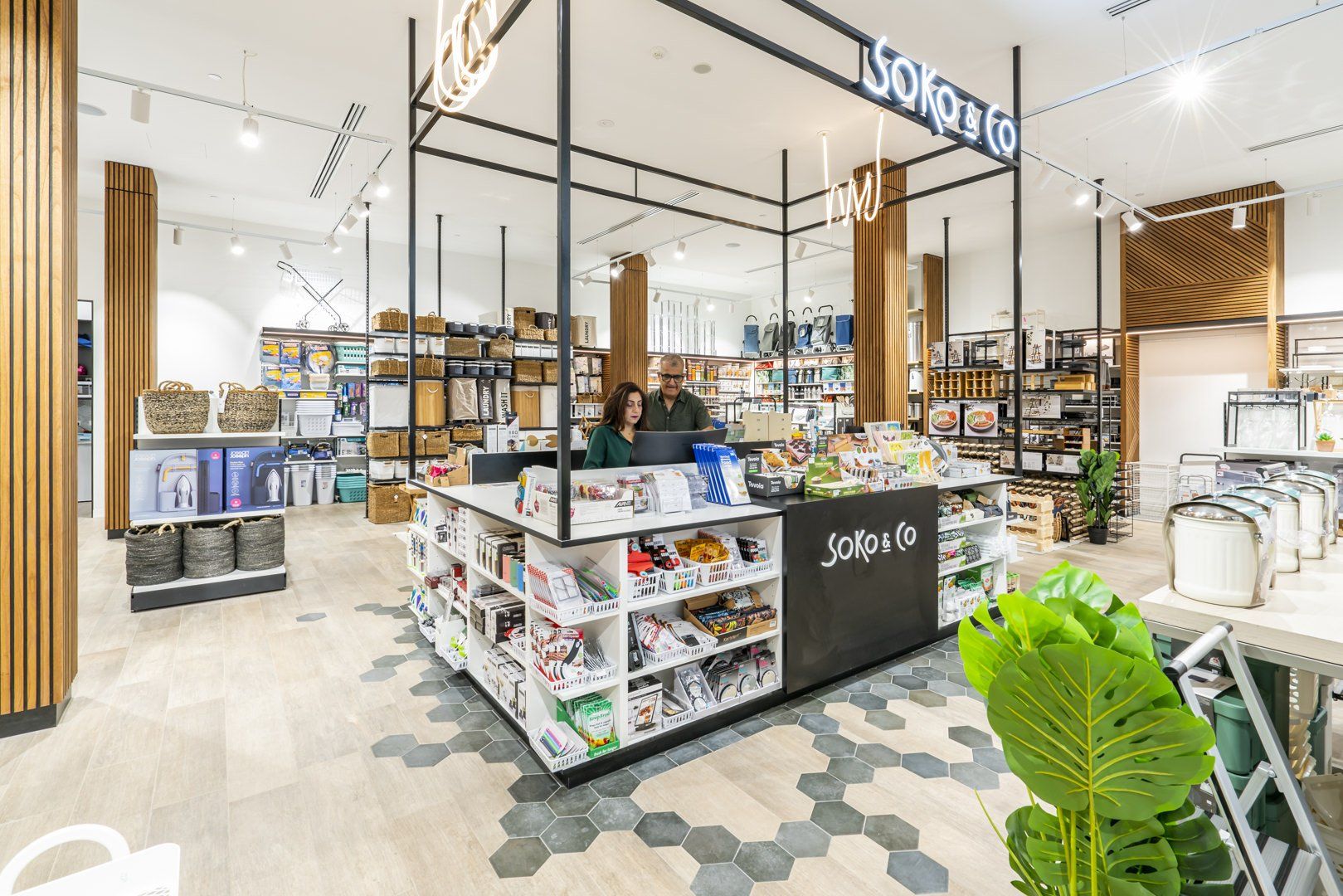 Soko & Co checkout counter with customers browsing storage, organisation and household products inside the retail store.