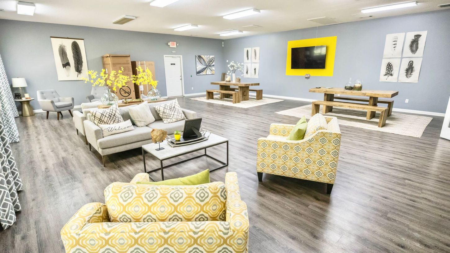 A living room filled with furniture and a flat screen tv.