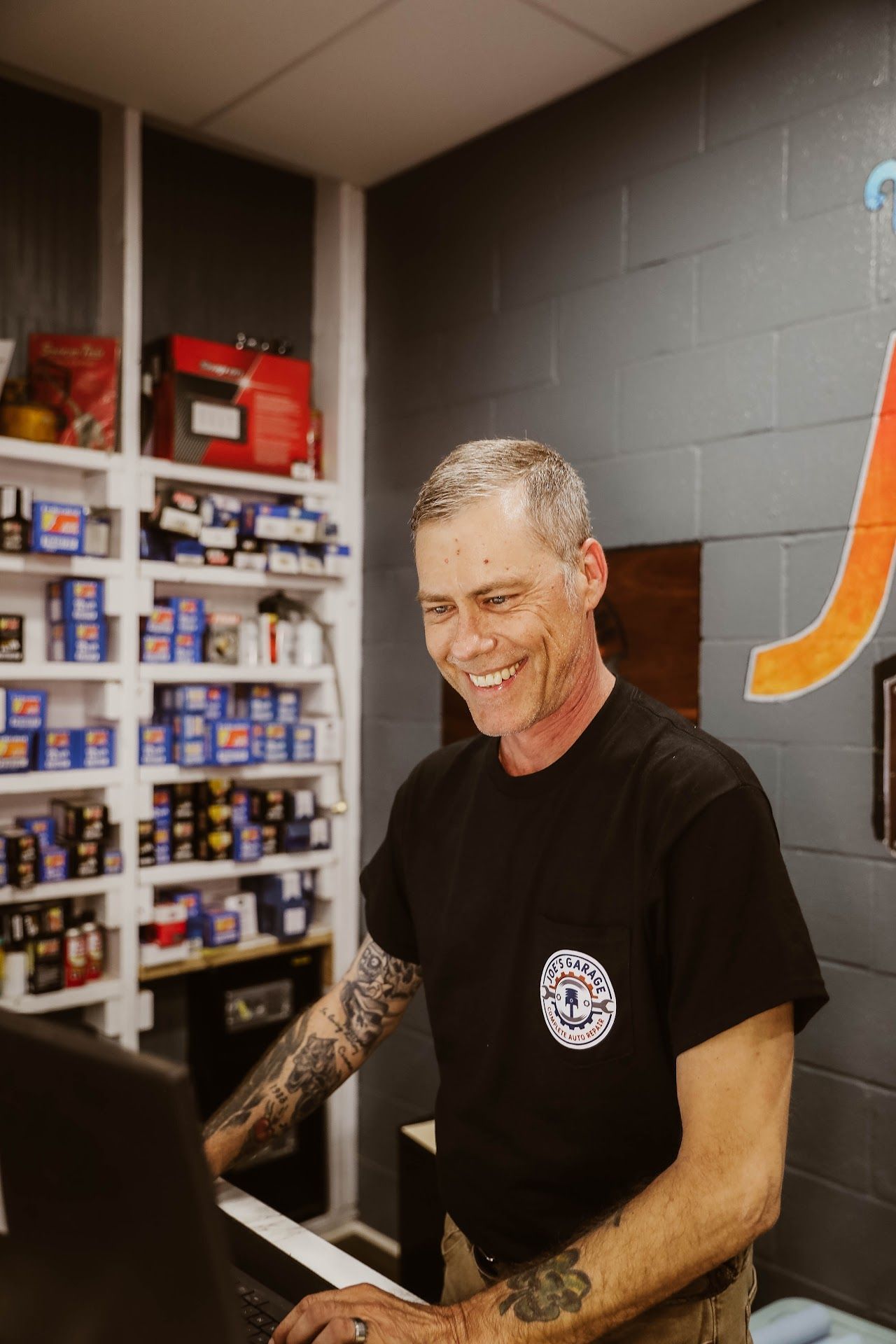 Member Behind Counter | Joe's Garage and Tire