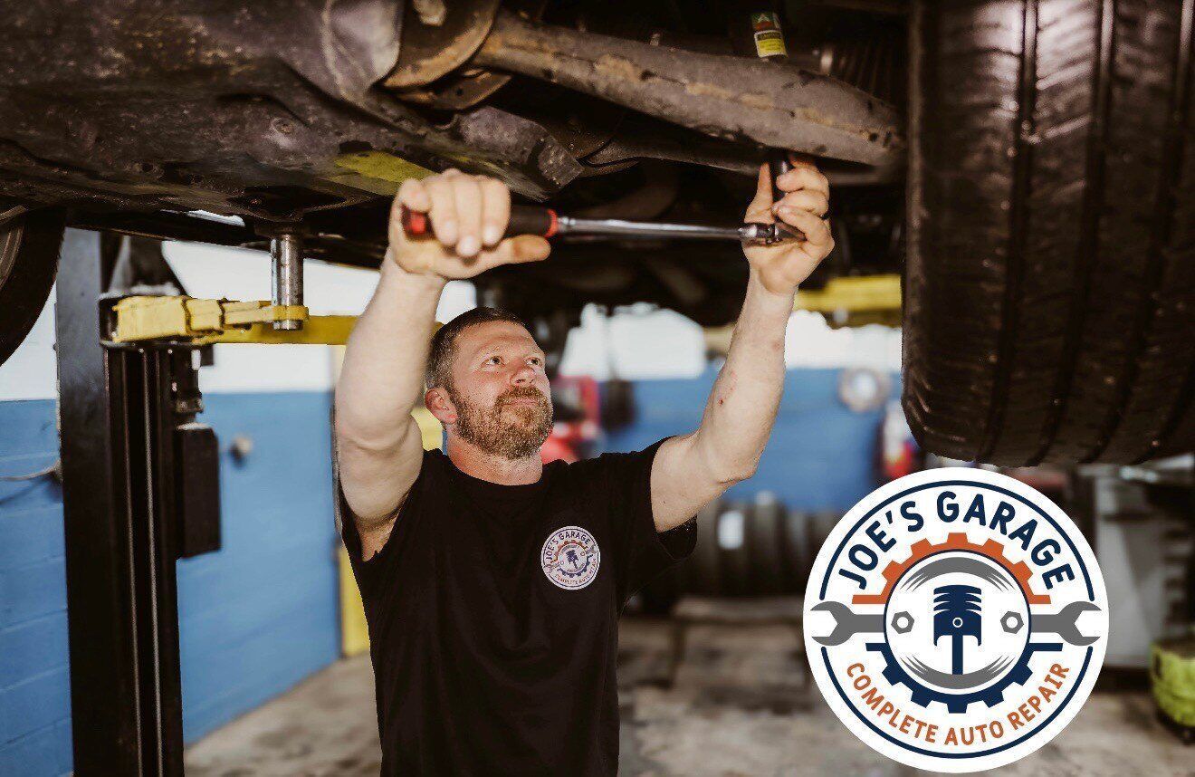 Mechanic Working on a Vehicle | Joe's Garage and Tire