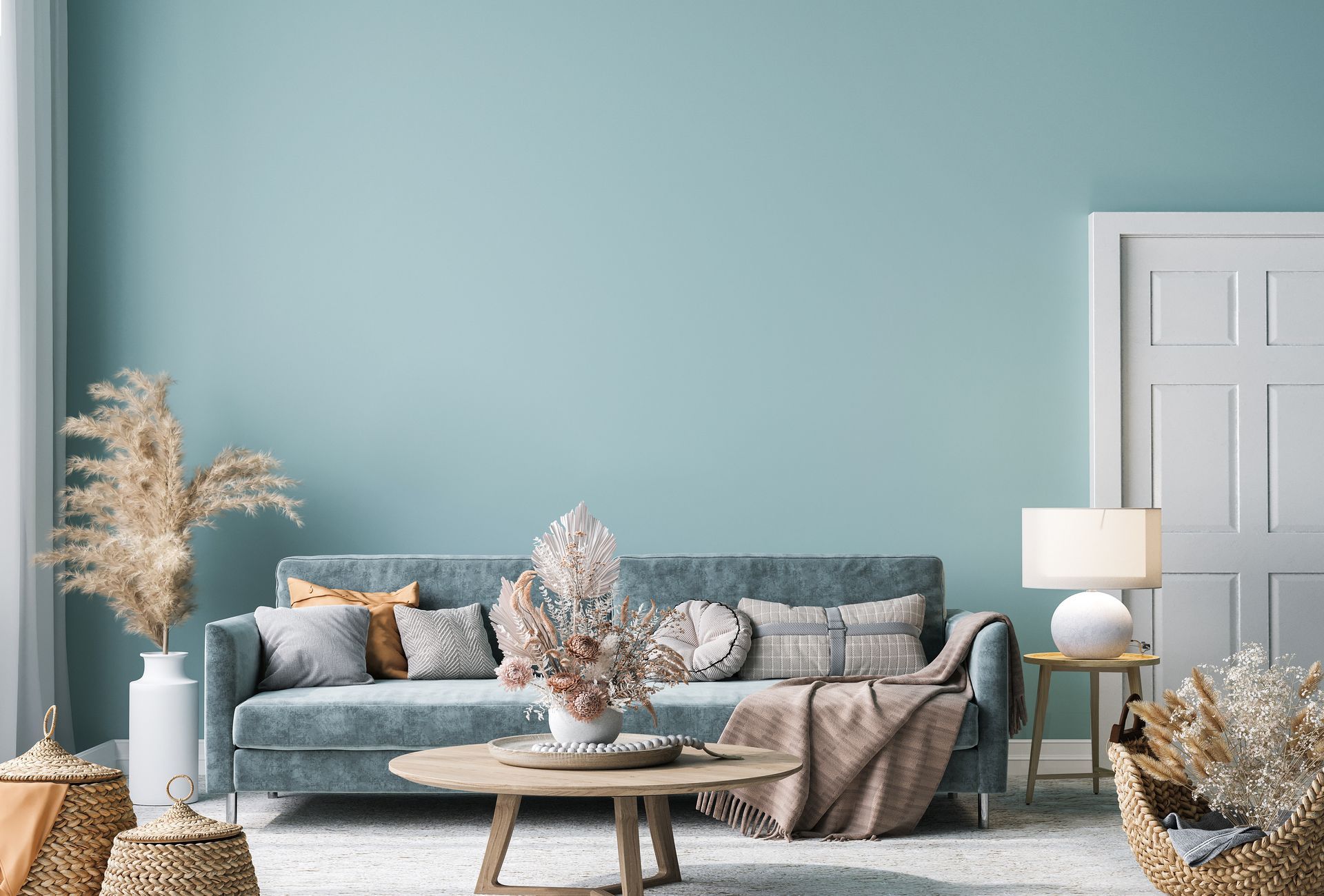 Modern teal living room with blue sofa, coffee table, floor lamp, and white doors
