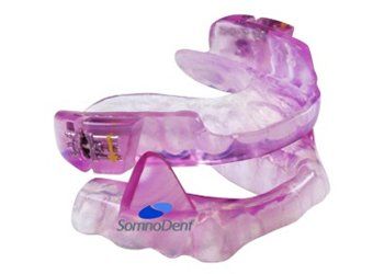 A purple mouth guard with the word somnodent on it