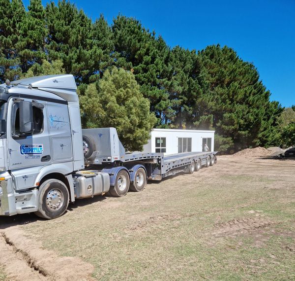 Supatilt Towing Truck Loading Building onto Trailer — Towing in Ballarat , VIC