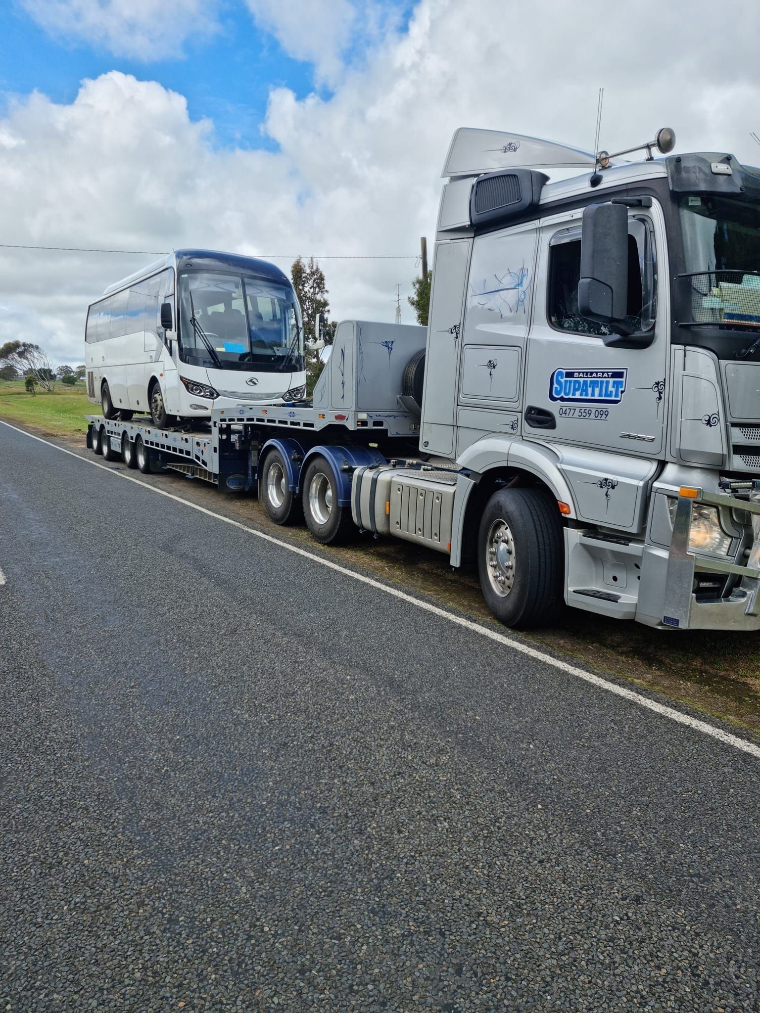A Red Car is Being Towed by a Tow Truck — Ballarat Supatilt in Delacombe, VIC
