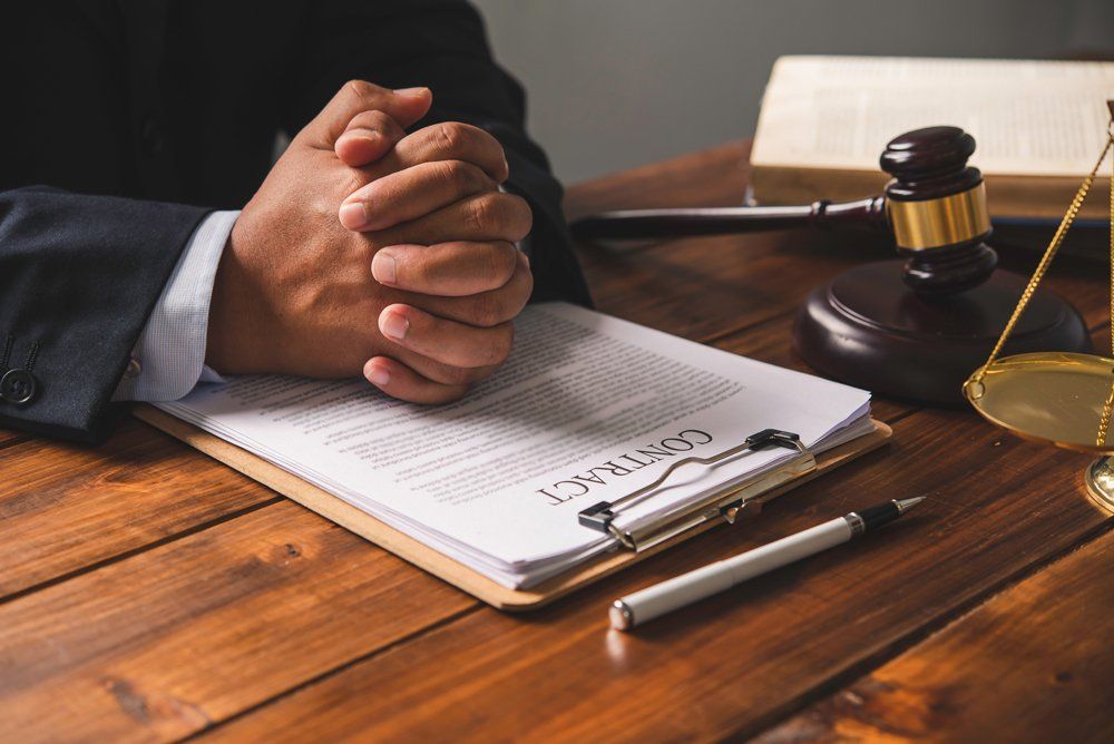 Lawyer Presenting A Contract — Gibsonville, NC — Walker & Bullard PA