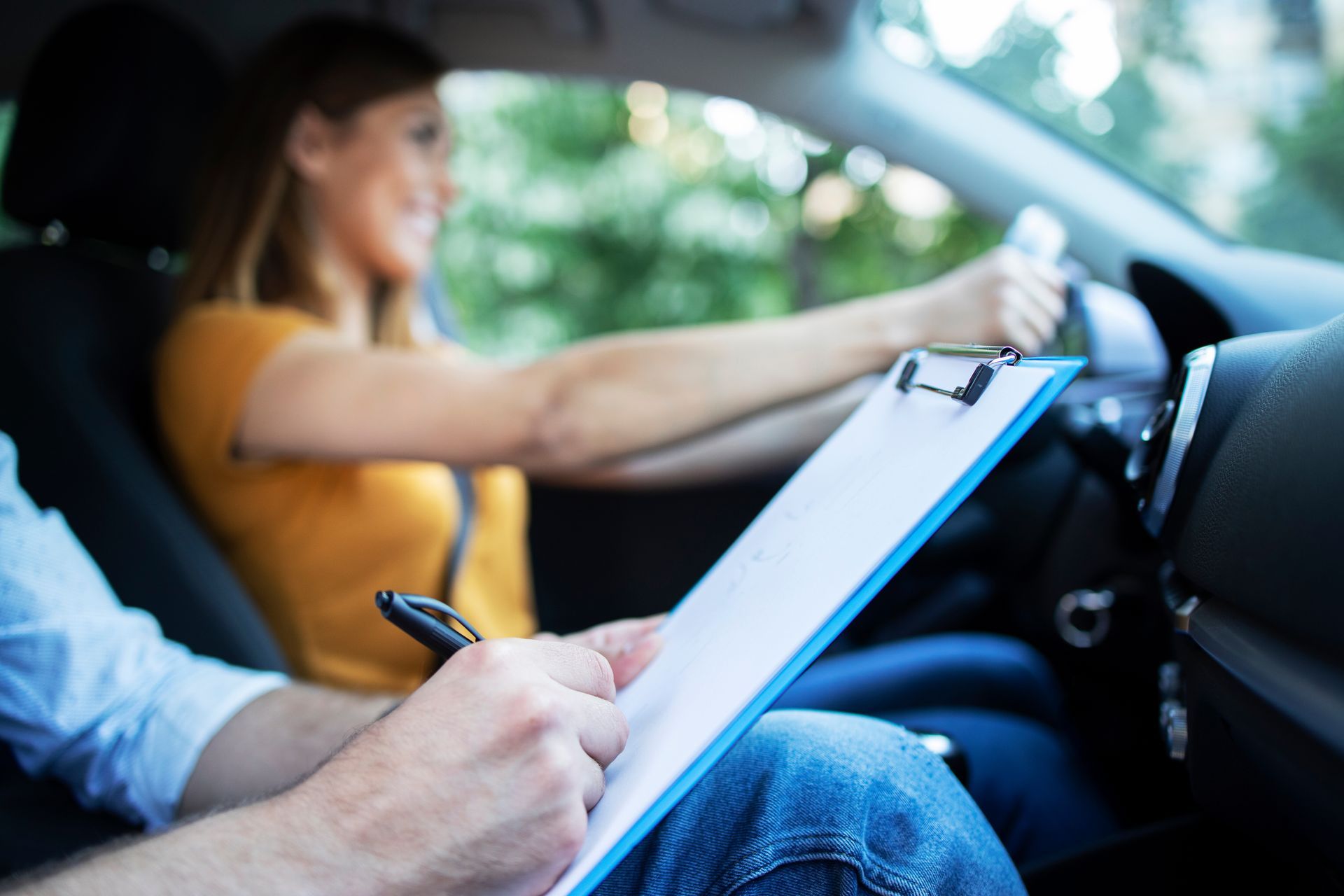Woman driving, taking a driving test. Woman driving, taking a driving test.