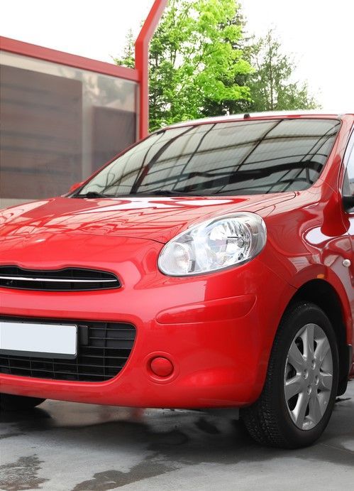 Car exterior after valet service, with gleaming paintwork and spotless wheels.