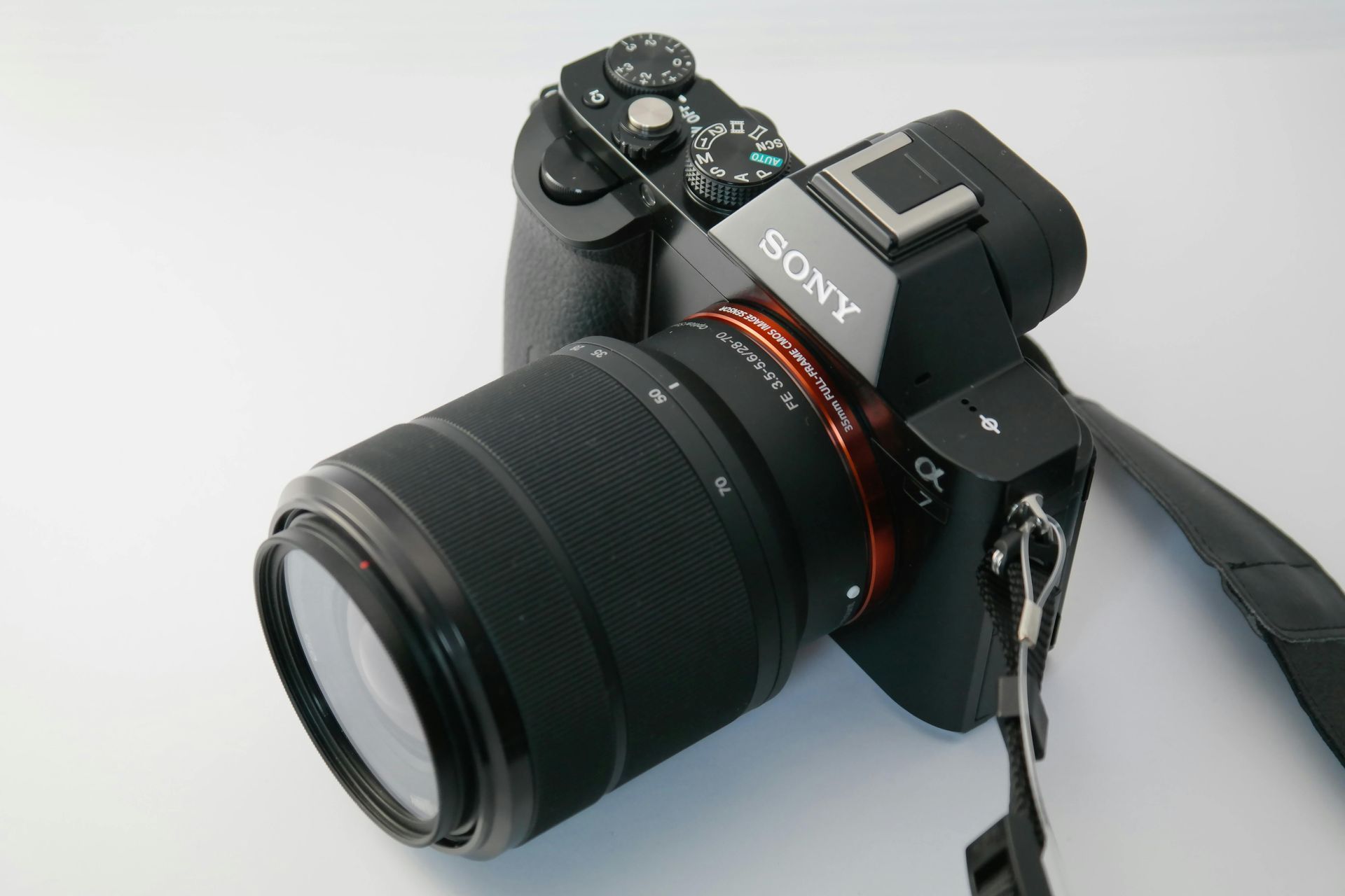 A close up of an instax camera on a black background