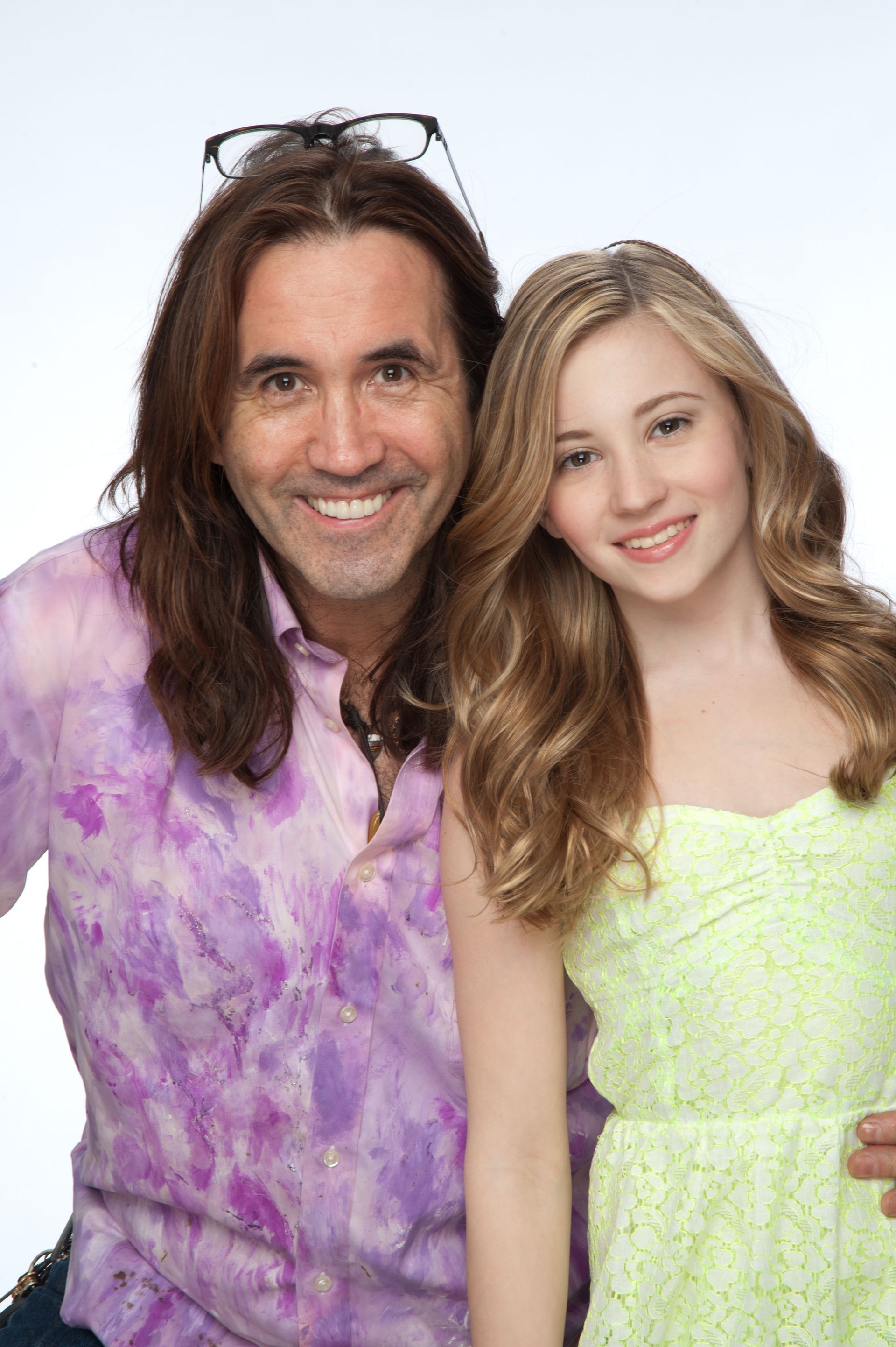 David and a girl are posing for a picture together.