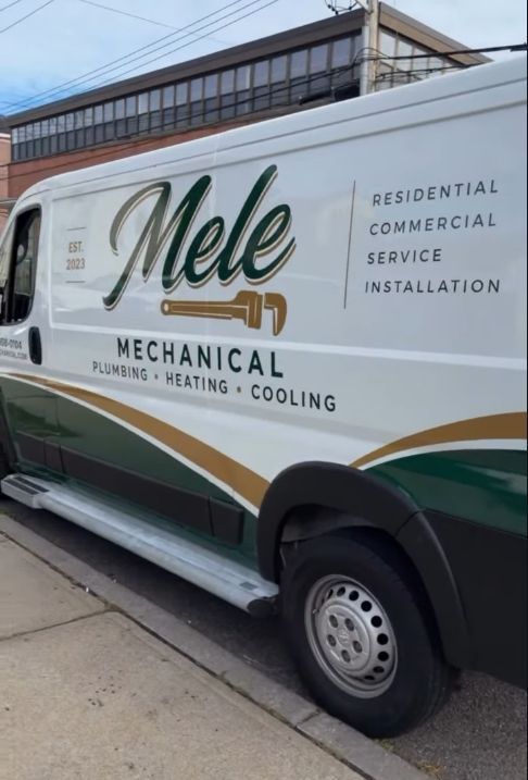 White service van with βMele Mechanicalβ HVAC branding and green-gold stripes parked by a building
