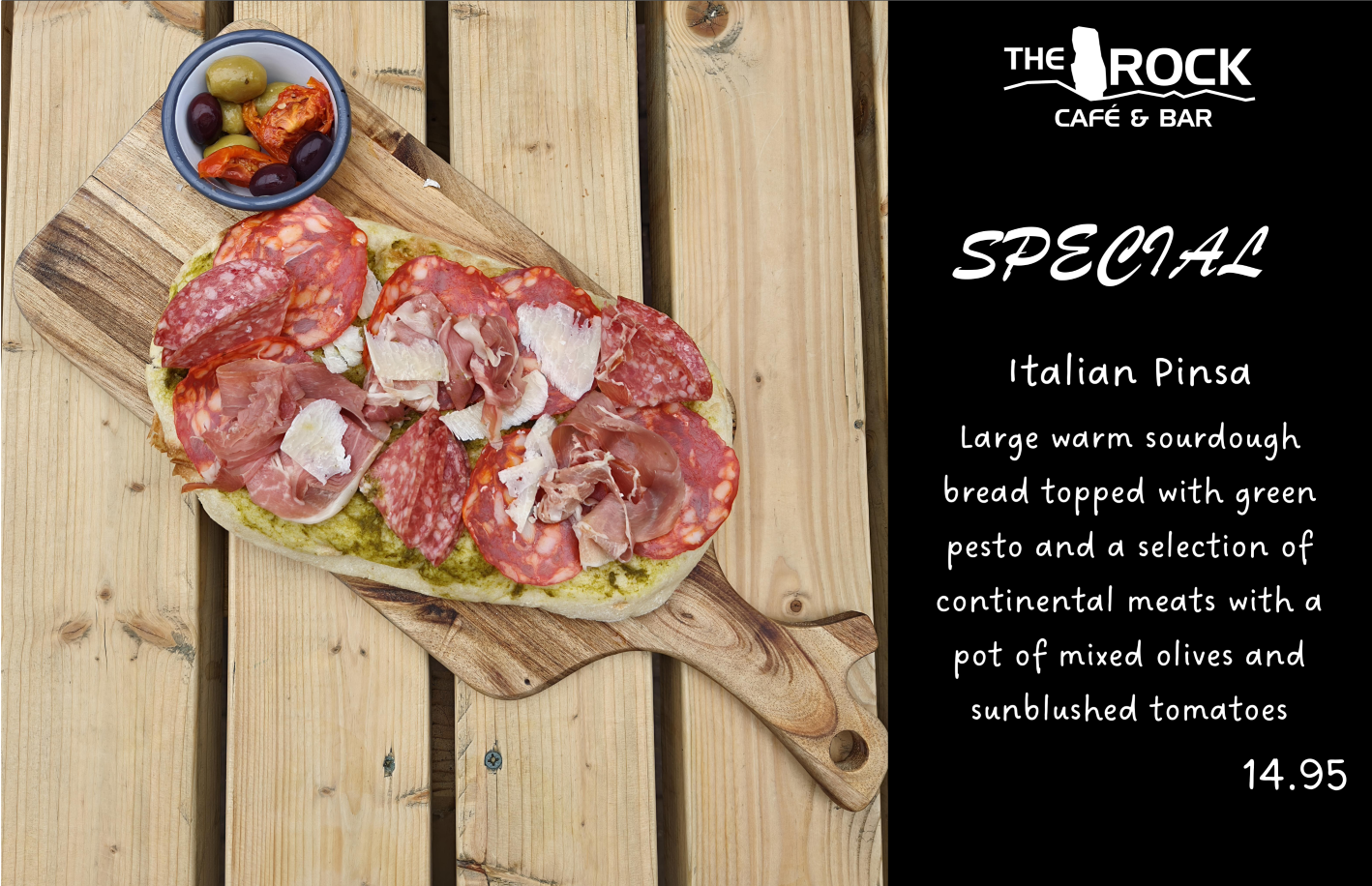 Italian Pinsa on wooden board with olives & sun-dried tomatoes,