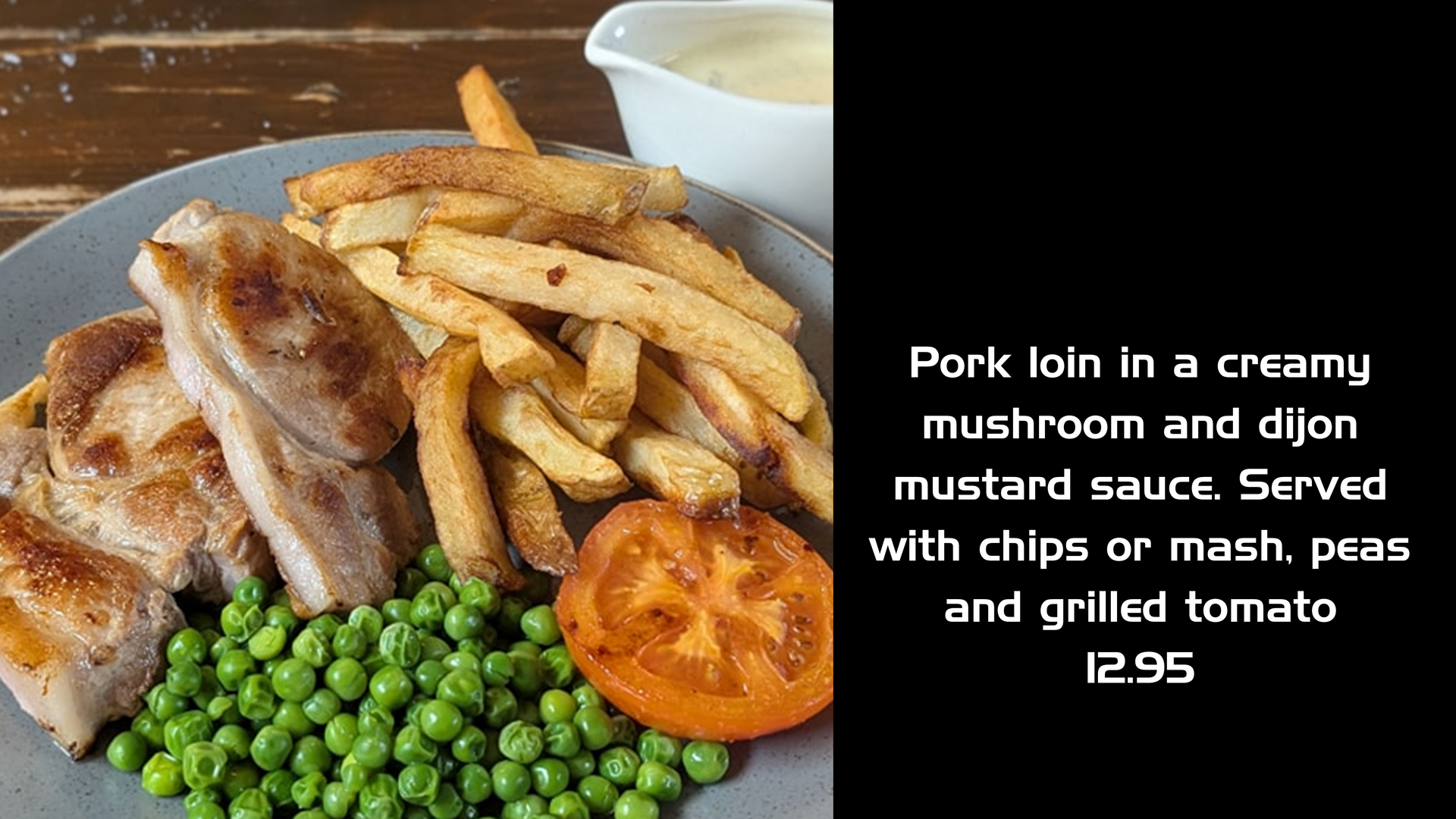 Pork loin with creamy mushroom sauce, chips, peas, and grilled tomato.