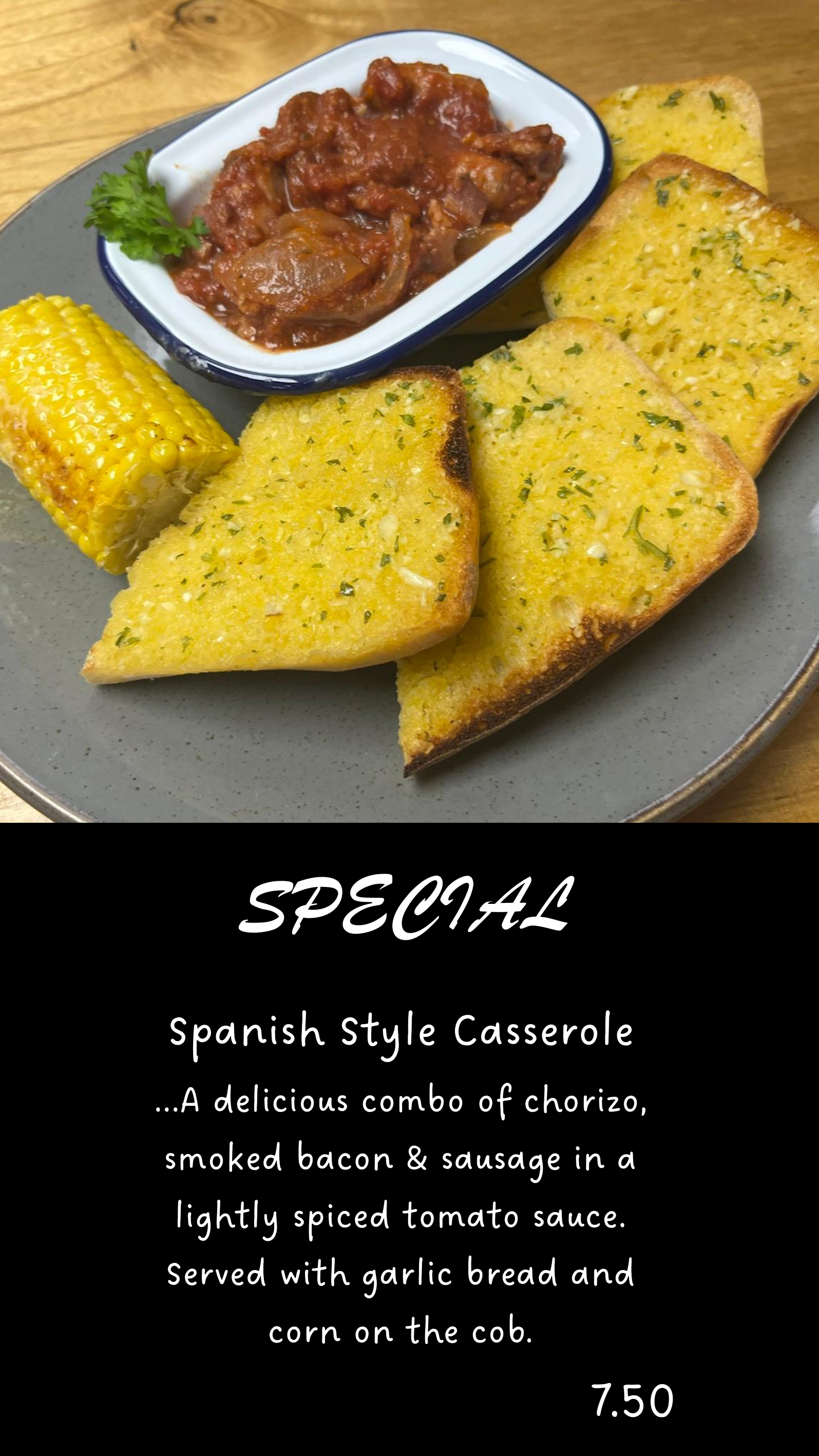 Spanish casserole special with chorizo, garlic bread, and corn on the cob.