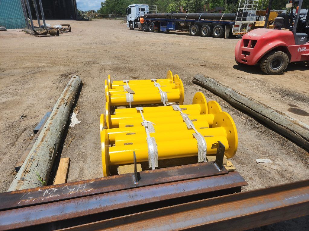 Yellow Industrial Machinery on a Forklift in a Yard, With Trucks and Equipment — Vent Doors Australia in Bohle, QLD