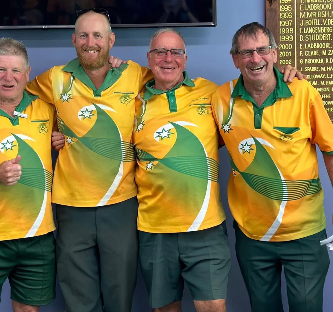 A Group Of Men Wearing Yellow And Green Shirts Are Posing For A Picture — Pacific Palms Bowling Club In Smiths Lake, NSW