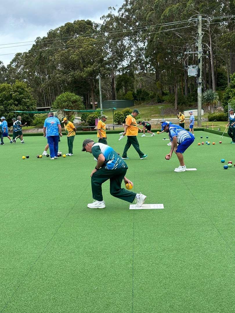 A Group Of People Are Playing A Game Of Bowling On A Green Field — Pacific Palms Bowling Club In Smiths Lake, NSW