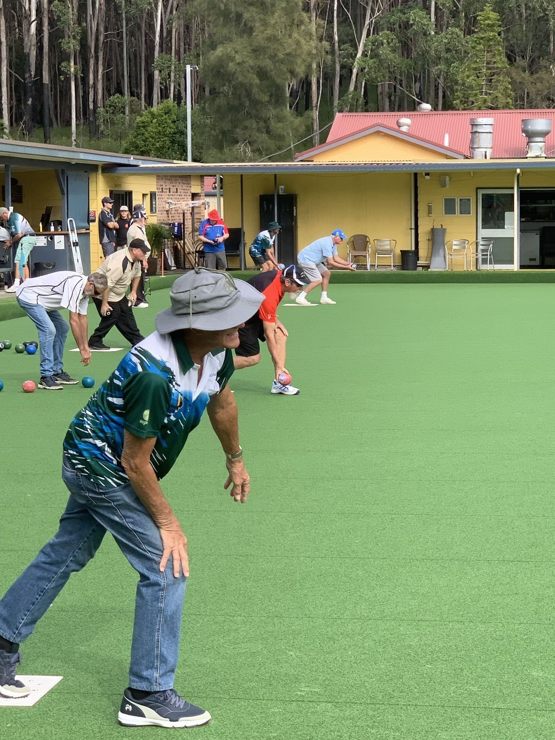 A Group Of People Are Playing A Game Of Bowling On A Lush Green Field — Pacific Palms Bowling Club In Smiths Lake, NSW