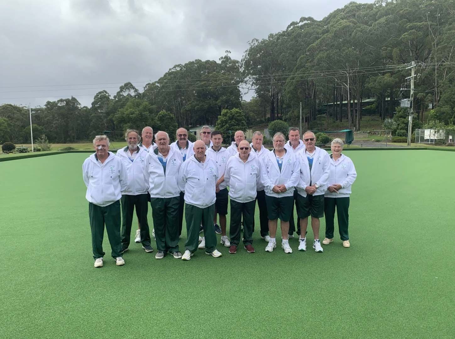 A Group Of Men Are Posing For A Picture On A Green Field — Pacific Palms Bowling Club In Smiths Lake, NSW