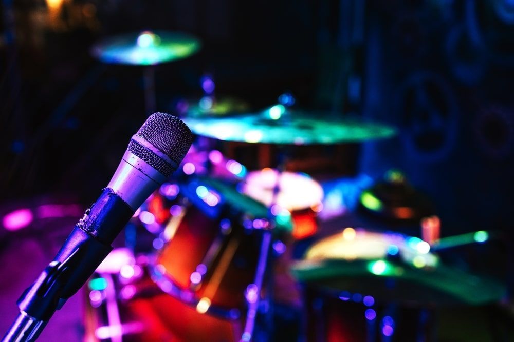 A Drum Set With A Microphone In Front Of It — Pacific Palms Bowling Club In Smiths Lake, NSW