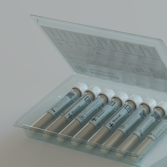 Open box of six syringe-like vials with labels inside a clear plastic case.