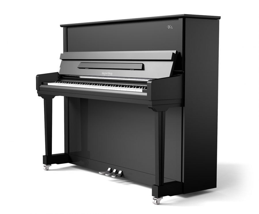 A black upright piano is sitting on a white surface.