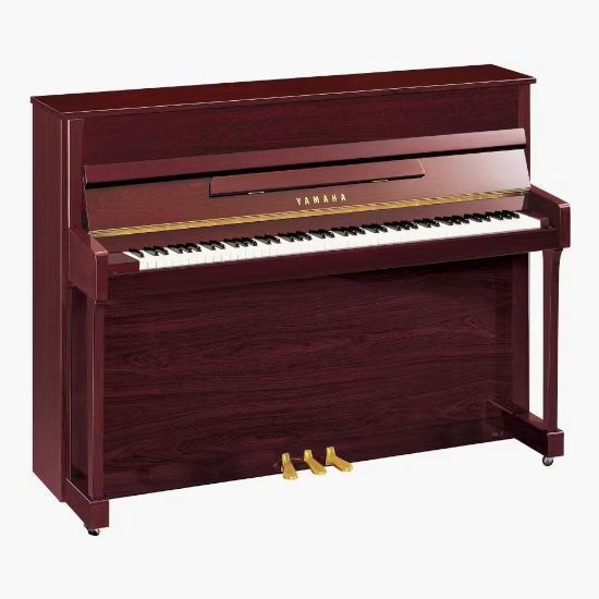 A yamaha piano is sitting on a white surface