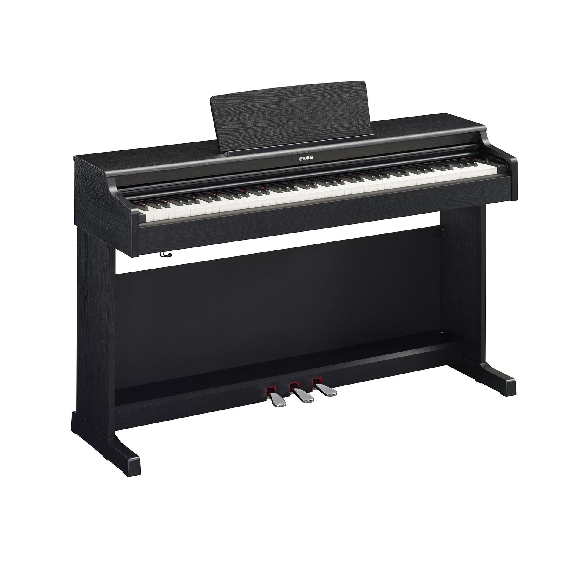 A black digital piano is sitting on top of a white table.