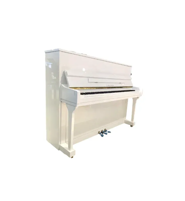 A white upright piano is sitting on a white surface.