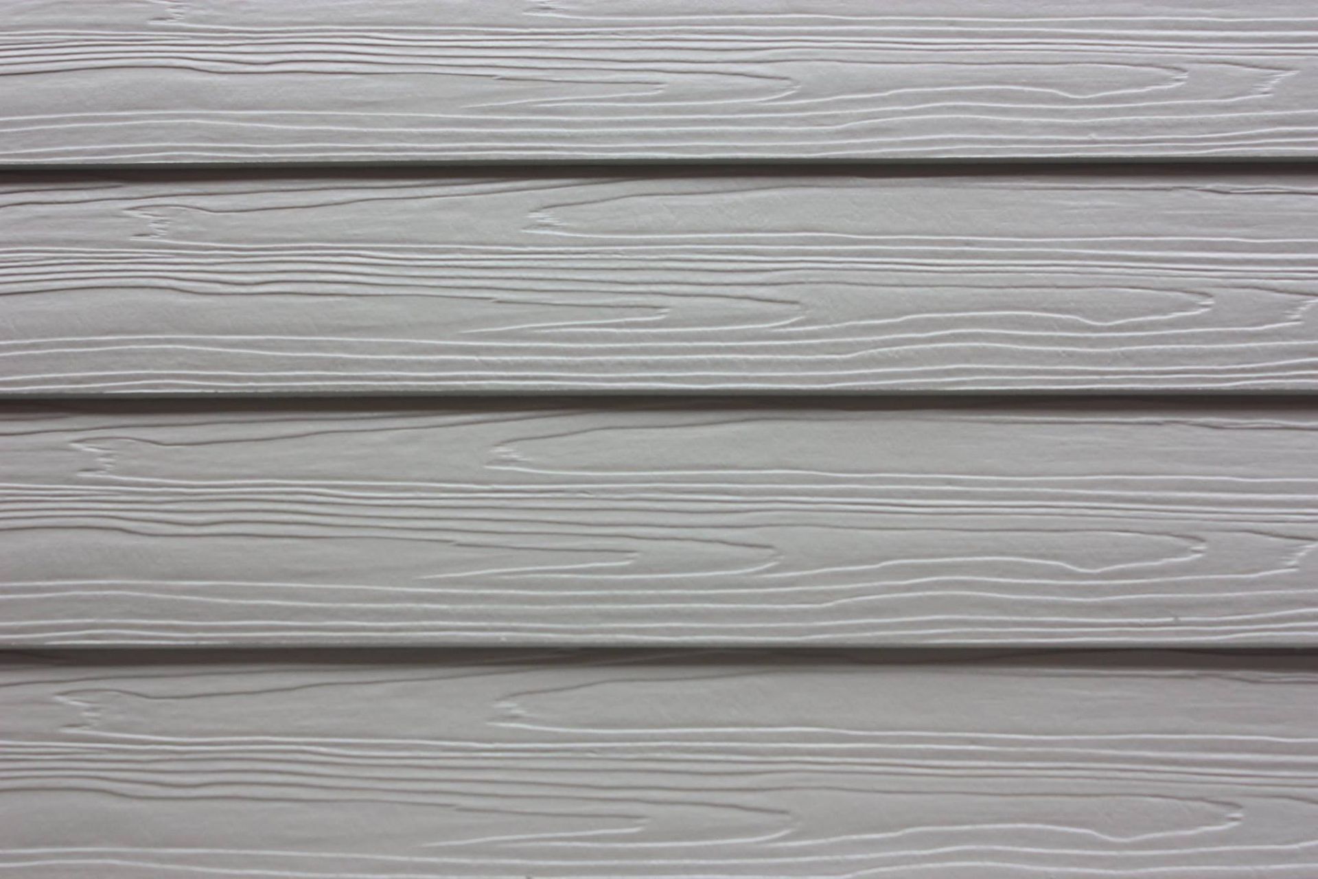 Gray horizontal wood-grain siding planks with narrow gaps between each panel.