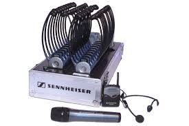 Sennheiser wireless microphone system in case with multiple bodypacks, headset, and handheld microphone.
