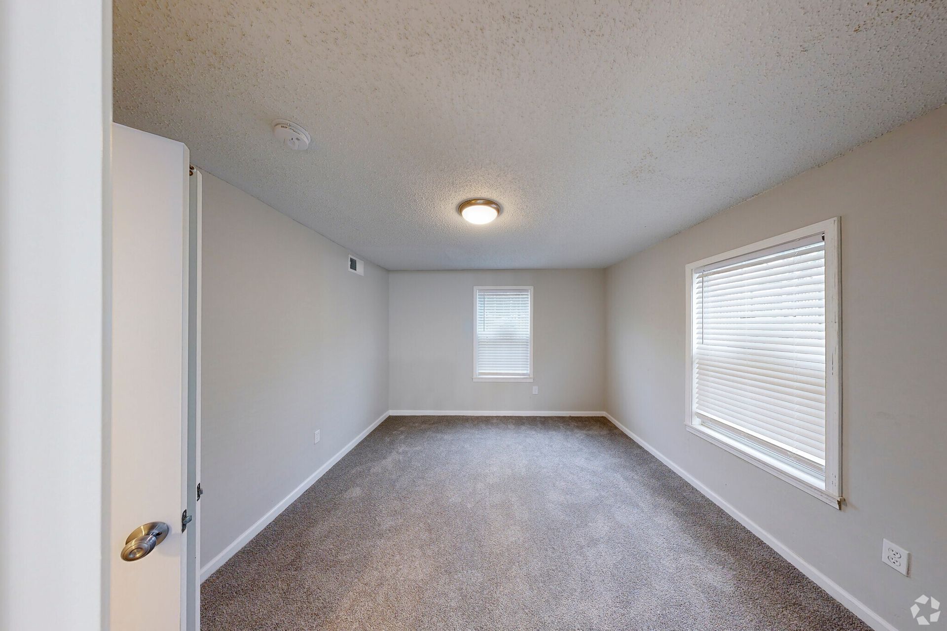 Photo of bedroom with two windows