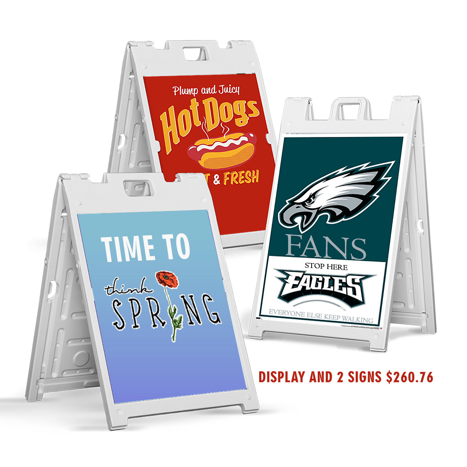 Three white A-frame sidewalk signs with seasonal and sports graphics, including “Time to spring,” “Hot Dogs,” and Eagles fans.