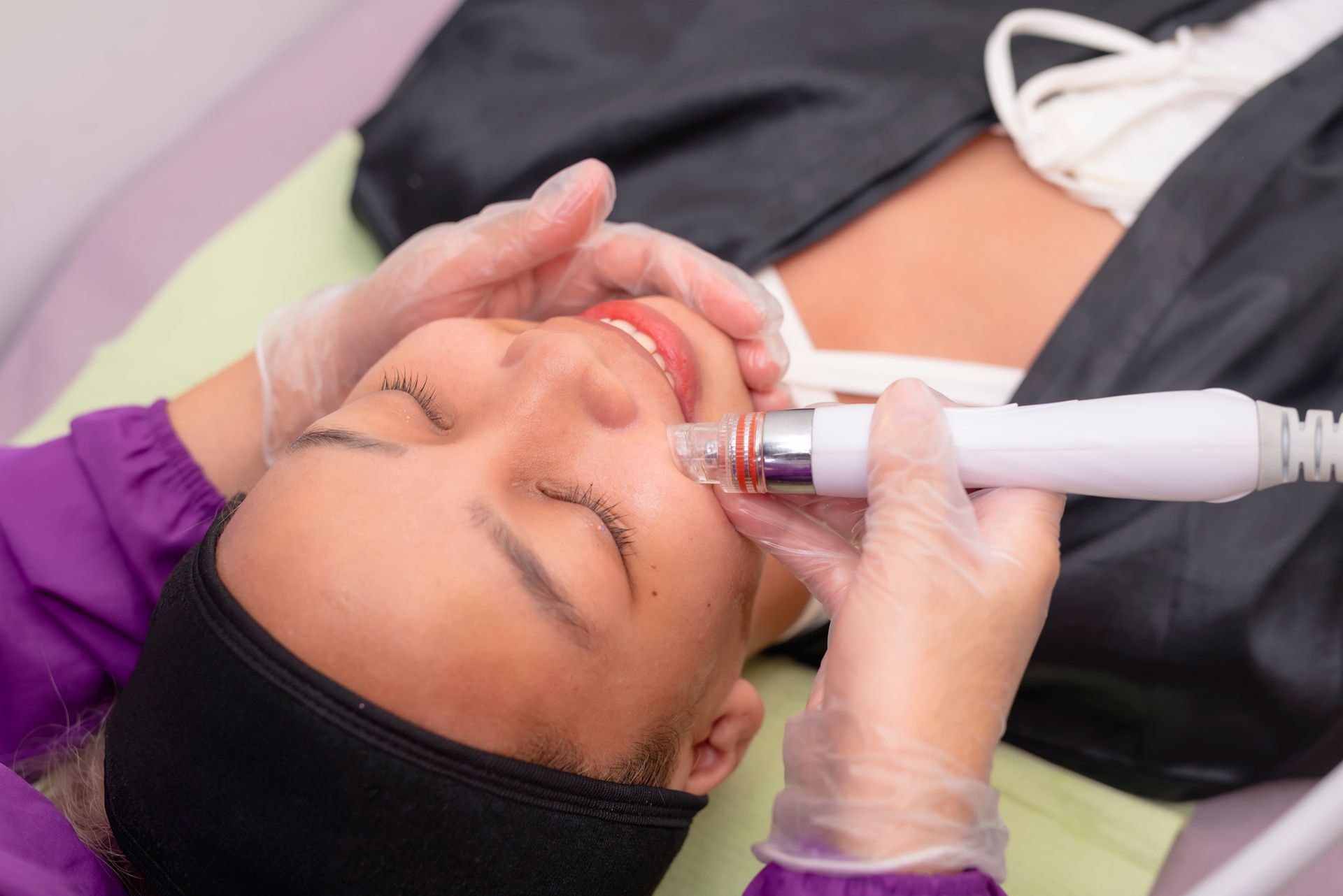 A woman is getting cosmetic allergan botox in her face.