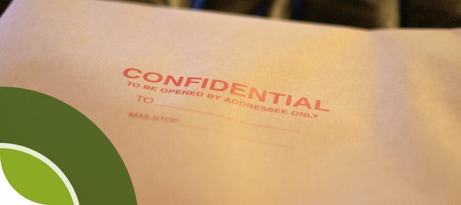 A close up of a confidential envelope on a table.