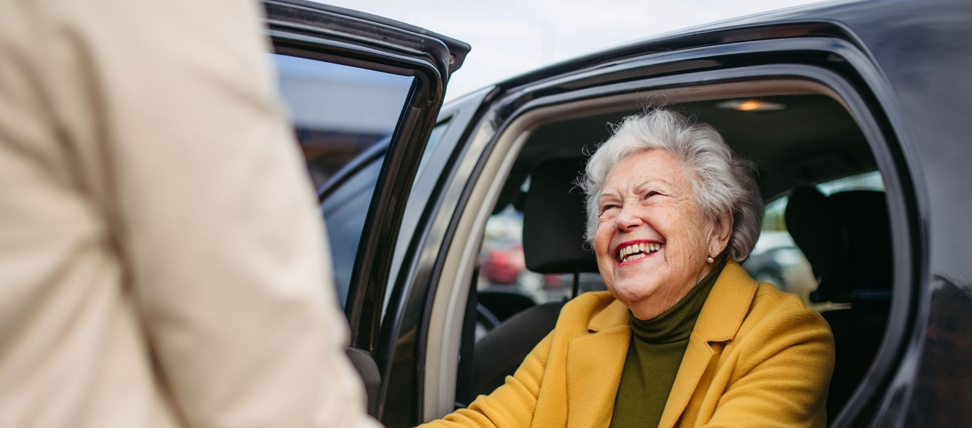 Older Australian woman smiling on a community outing