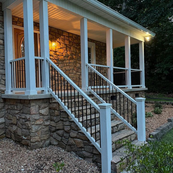 A ladder is sitting in front of a house under construction.
