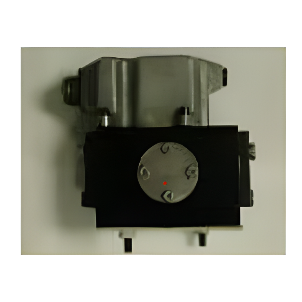 Black and silver mechanical device with a circular dial on a plain background