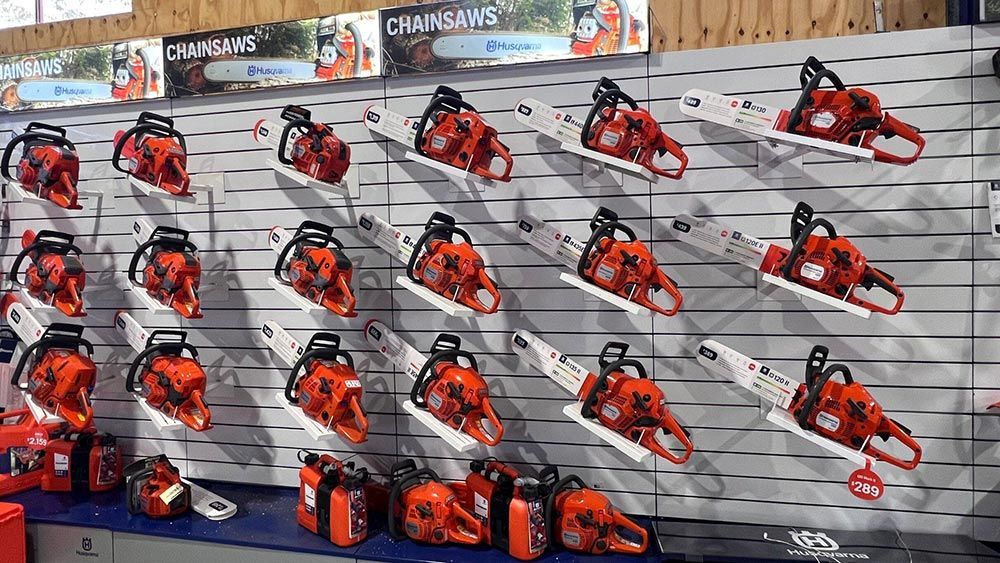 A Wall Filled with Lots of Chainsaws in A Store — CBS Chainsaw & Brushcutter Specialists - HUSQVARNA in Comboyne, NSW