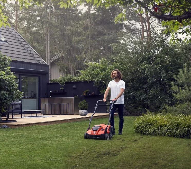 Man With Scarifier On Lawn — CBS Chainsaw & Brushcutter Specialists - HUSQVARNA in Wauchope, NSW
