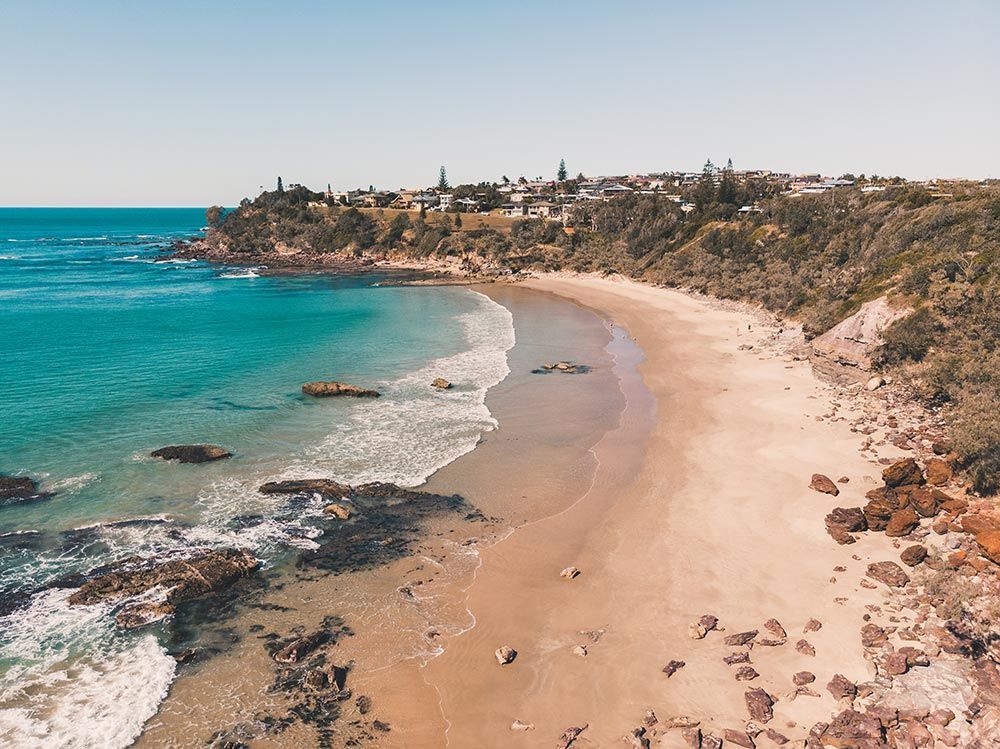 An Aerial View of a Beach With a City in the Background — CBS Chainsaw & Brushcutter Specialists - HUSQVARNA in Port Macquarie, NSW