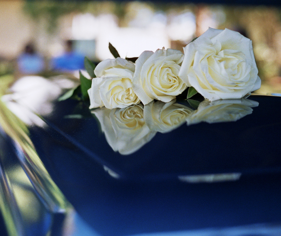Roses on top of a casket at a prearranged funeral service.
