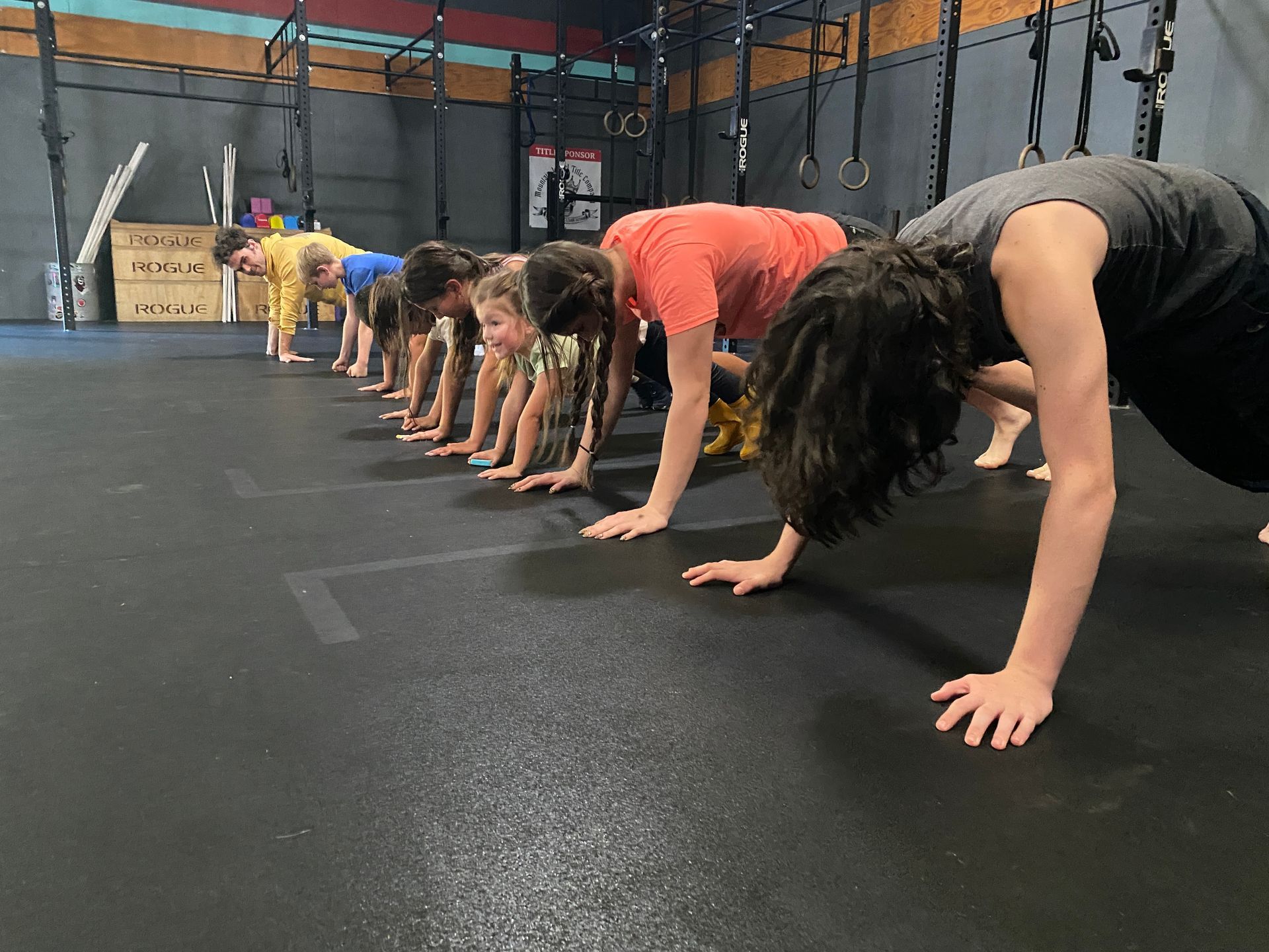 Young athlete practicing a bear crawl during a coached training session at The Training Lab