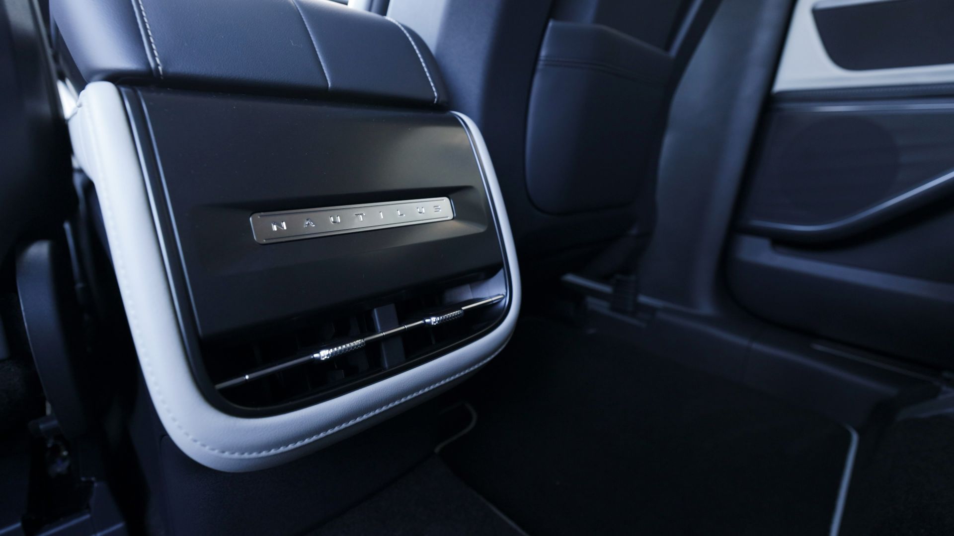A close up of the back seat of a car.