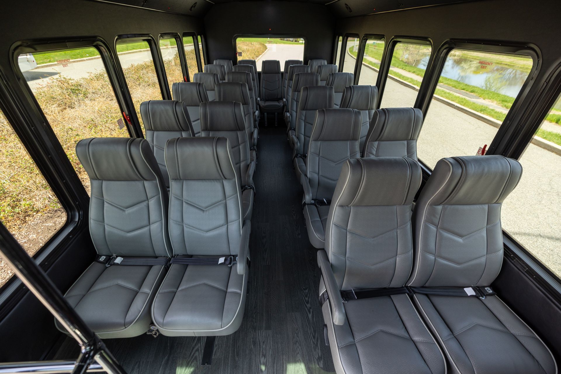 Interior seating of black shuttle bus.